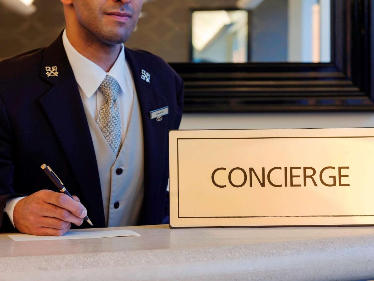 Sofitel Melbourne On Collins Hotel Екстериор снимка Concierge at the front desk of a hotel
