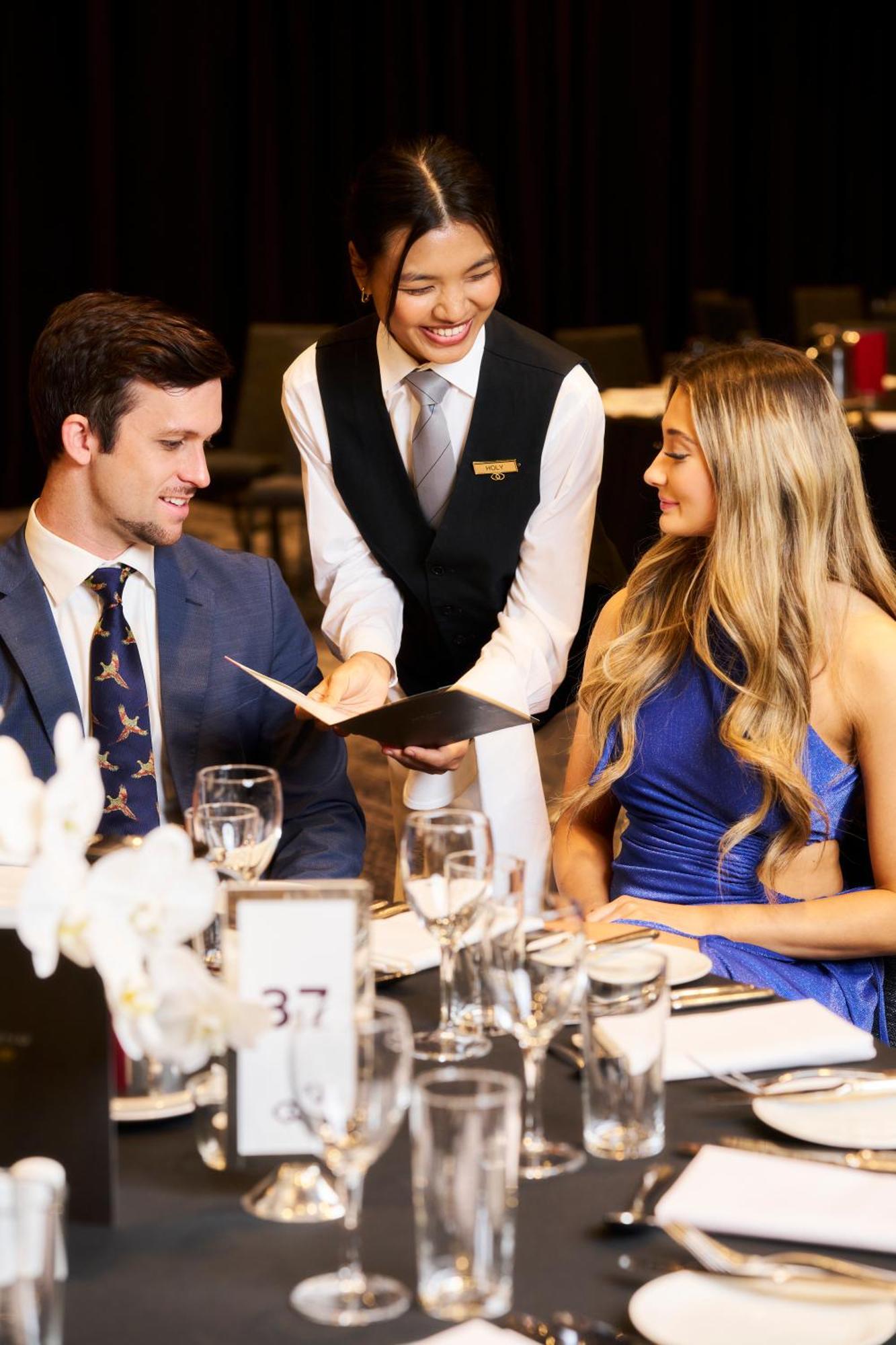 Sofitel Melbourne On Collins Hotel Екстериор снимка A waiter serving a couple